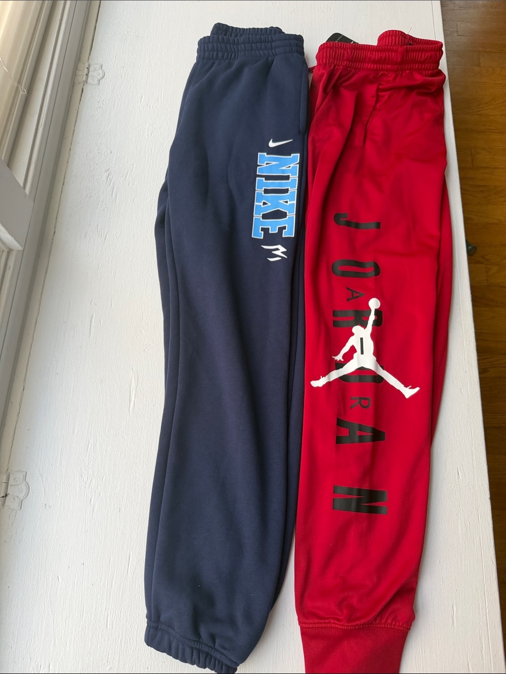 Bundle Jordan Red Sweatpants with White Jumpman Logo and blue Nike sweat pants